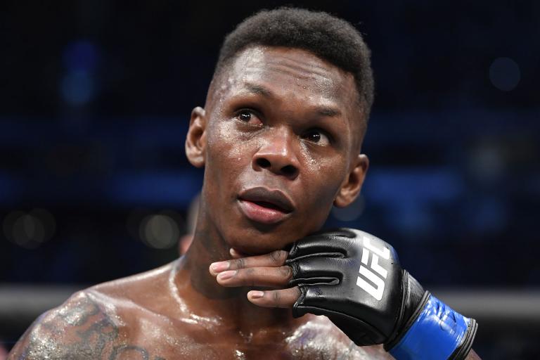 Israel Adesanya of Nigeria celebrates after his knockout victory over Robert Whittaker of New Zealand in their UFC middleweight championship fight during the UFC 243 event at Marvel Stadium on October 06, 2019 in Melbourne, Australia. (Photo by Jeff Bottari/Zuffa LLC)