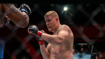 Sergei Pavlovich of Russia punches Curtis Blaydes in the UFC APEX on April 22, 2023. (Zuffa LLC)