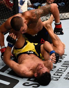 VANCOUVER, BC - AUGUST 27:  Anthony Pettis of the United States (top) punches Charles Oliveira of Brazil in their featherweight bout during the UFC Fight Night event at Rogers Arena on August 27, 2016 in Vancouver, British Columbia, Canada. (Photo by Jeff