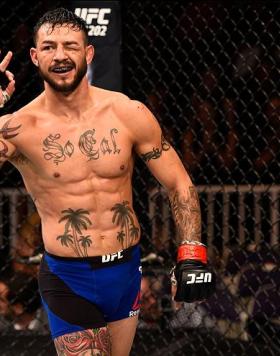 SALT LAKE CITY, UT - AUGUST 06:  Cub Swanson raises his hand after facing Tatsuya Kawajiri of Japan in their featherweight bout during the UFC Fight Night event at Vivint Smart Home Arena on August 6, 2016 in Salt Lake City, Utah. (Photo by Jeff Bottari/Z