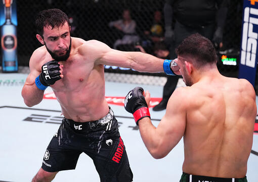 Loik Radzhabov of Tajikistan punches Abdul-Kareem Al-Selwady during the UFC Fight Night event at UFC APEX on March 02, 2024 in Las Vegas, Nevada. (Photo by Jeff Bottari/Zuffa LLC)