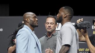 Opponents Kamaru Usman and Leon Edwards pose on stage during the UFC 278 press conference