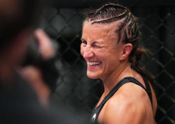 Sam Hughes reacts after her TKO victory over Elise Reed in a strawweight bout during the UFC Fight Night event at UFC APEX on May 21, 2022 in Las Vegas, Nevada. (Photo by Chris Unger/Zuffa LLC)