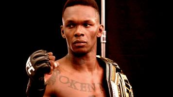 Israel Adesanya poses for a photo for UFC 276 Media Day