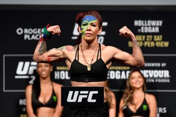 Cris Cyborg of Brazil poses on the scale during the UFC 240 weigh-in at Rogers Place on July 26, 2019 in Edmonton, Alberta, Canada. (Photo by Jeff Bottari/Zuffa Getty Images)