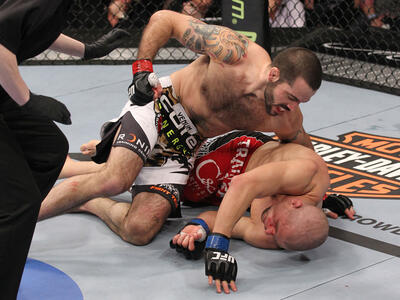 LAS VEGAS, NV - FEBRUARY 04:  Matt Brown (white shorts) attempts to finish Chris Cope during the UFC 143 event at Mandalay Bay Events Center on February 4, 2012 in Las Vegas, Nevada.  (Photo by Nick Laham/Zuffa LLC/Zuffa LLC via Getty Images) *** Local Ca